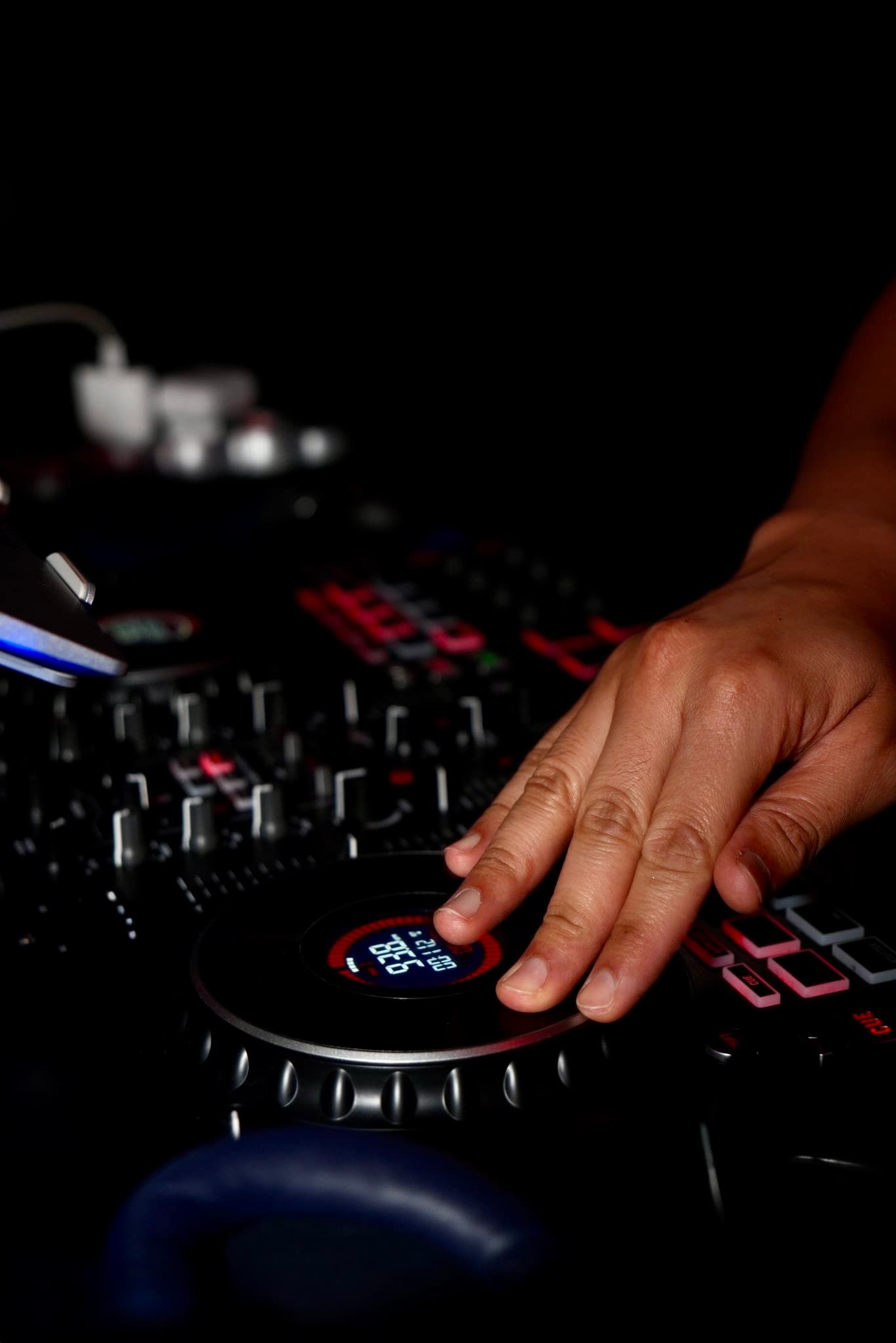 DJ on the decks during a Latin night at La Perla club